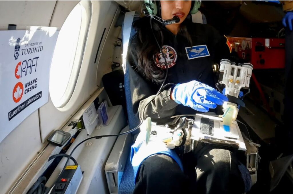 Dr. Shawna Pandya testing the handheld 3D bioprinter during reduced-gravity flight.